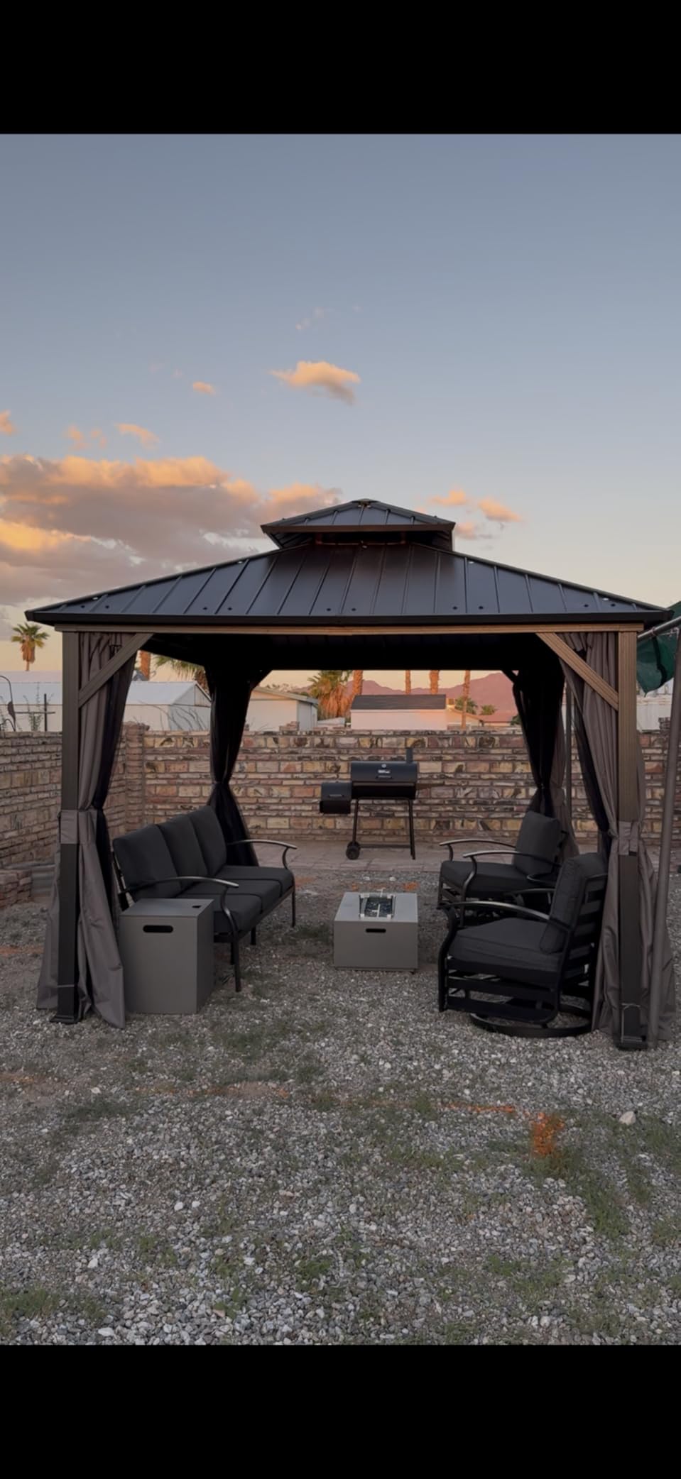A family sharing dinner under a cedar patio cover