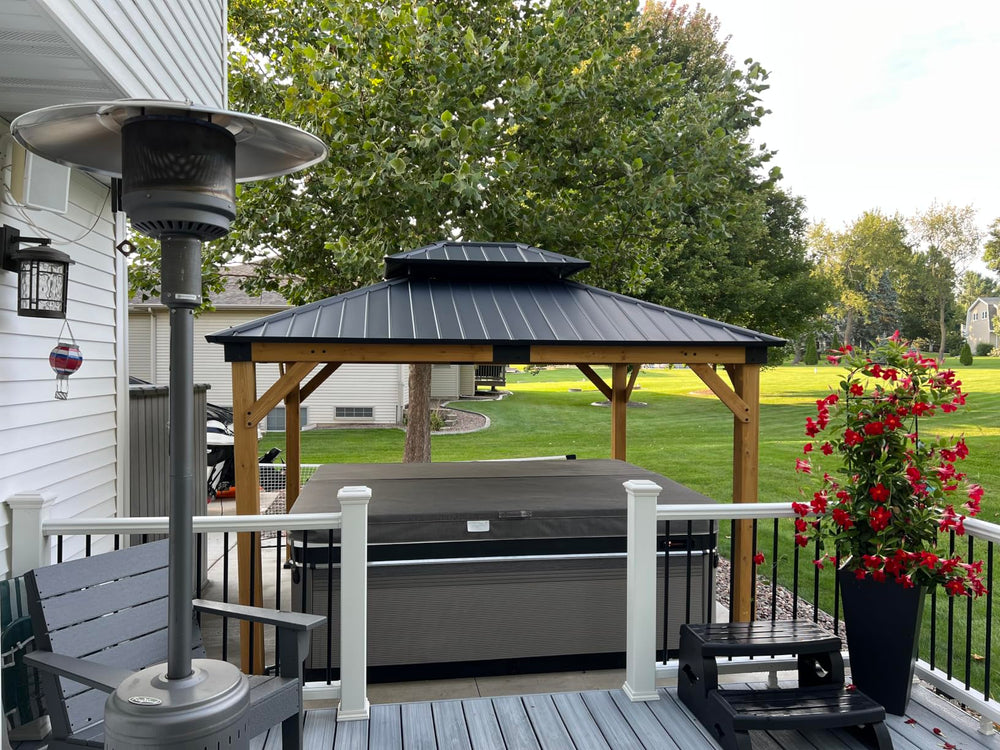 A lakeside aluminum gazebo with string lights